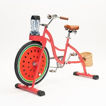 Red bicycle with watermelon basket